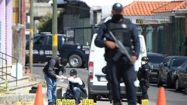 Police officers work at a crime scene where gunmen killed at least 13 Mexican police officers in an ambush, in Coatepec Harinas, Mexico March 19, 2021. (File photo: Reuters)