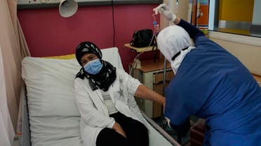Wahiba Doughan receives chemotherapy treatment for lung cancer at the government-run Rafik Hariri University Hospital in Beirut, Lebanon, Wednesday, Sept. 8, 2021. (AP/Hassan Ammar)