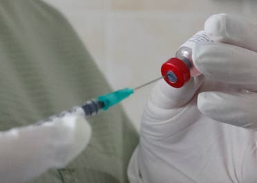 A stock photo of a nurse filling a syringe. (Reuters)
