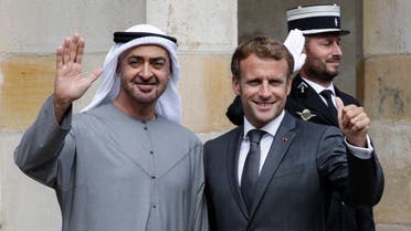 French President Emmanuel Macron (R) poses with Abu Dhabi Crown Prince Mohammed bin Zayed (L) upon their arrival at the Fontainebleau’s castle in Fontainebleau, on September 15, 2021, ahead of their working lunch. (Stefano Rellandini/AFP)