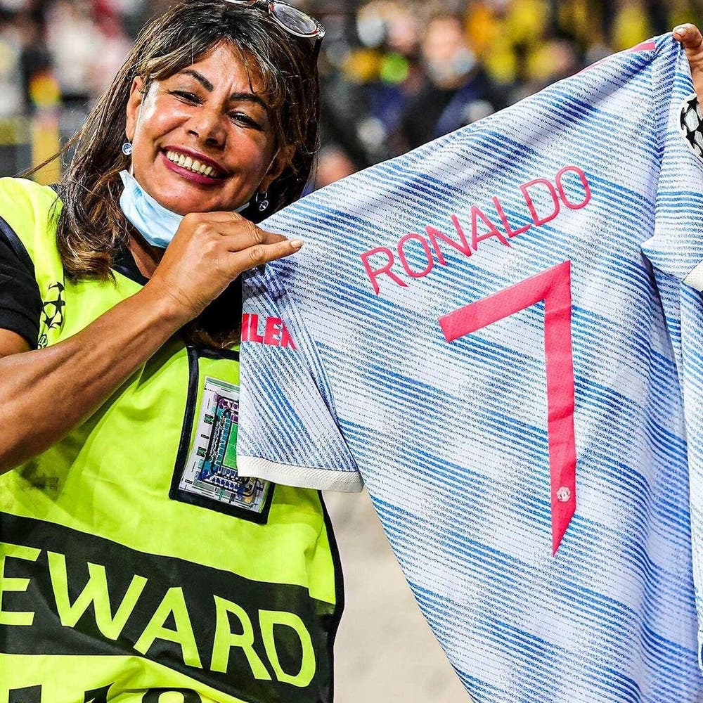 Cristiano Ronaldo makes steward's year by gifting shirt after hitting her  with ball during warm-up to Manchester United's Champions League defeat to  Young Boys