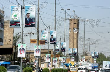 صور المرشحين للانتخابات العراقية معلقة في الشوارع (أرشيفية- فرانس برس)