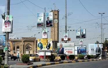 صور المرشحين للانتخابات العراقية معلقة في الشوارع (أرشيفية- فرانس برس)