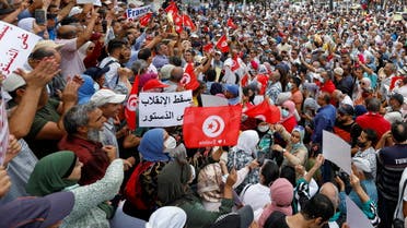 Opponents of Tunisia's President Kais Saied take part in a protest against what they call his coup on July 25, in Tunis, Tunisia September 18, 2021. (Reuters)