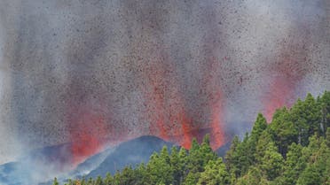 Lava and smoke rise following the eruption of a volcano in the Cumbre Vieja national park at El Paso, on the Canary Island of La Palma, September 19, 2021. (AFP)