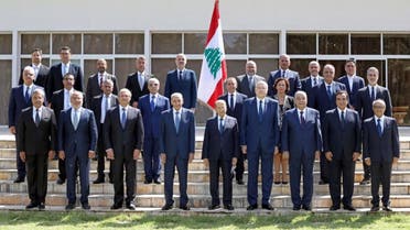 Lebanon's Parliament Speaker Nabih Berri (C-L) and President Michel Aoun (C) and Prime Minister-designate Najib Mikati (C-R) posing for a group photo with the newly formed government at the presidential palace in Baabda, east of the capital Beirut. (AFP)
