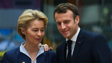 President of the European Commission Ursula von der Leyen (L) and France's President Emmanuel Macron speak prior to a European Union Summit at the Europa building in Brussels on December 12, 2019. (AFP)