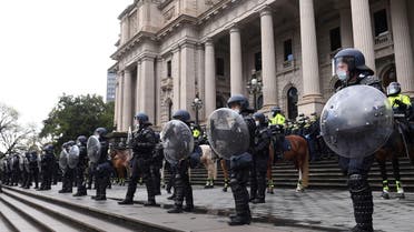 Riot police guard Victoria's Parliament House as construction workers and far right activists protest against coronavirus disease (COVID-19) restrictions in Melbourne, Australia, September 21, 2021. (Reuters)