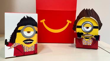 A cardboard McDonald’s Happy Meal toy is shown with a Happy Meal box on Sept. 20, 2021. (AP/Dee-Ann Durbin)(1)