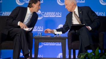 Then-VP Joe Biden leans over to talk with Amos Hochstein, former State Department Special Envoy for International Energy Affairs, Jan. 26, 2015. (File Photo: AP)