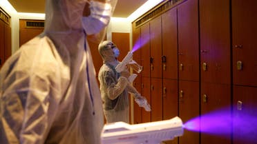 Cleaners wearing protective suits spray disinfectant at a Sauna and Spa centre to prepare the reopening, following the coronavirus disease (COVID-19) outbreak, in Hong Kong, China September 16, 2020. (File photo: Reuters)