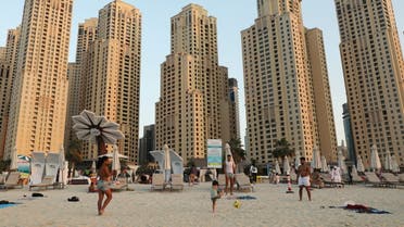 People play football at Jumeirah beach residence in Dubai, United Arab Emirates December 23, 2020. (Reuters)