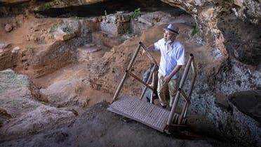 Archeologists walk to enter the Contrebandiers (Smugglers) Cave less than 20 kilometers from the Moroccan capital Rabat, on September 18, 2021. (Fadel Senna/AFP)