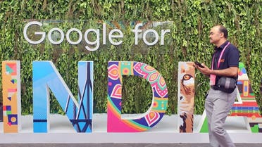 A man walks past the sign of Google for India, the company's annual technology event in New Delhi, India. (Reuters)