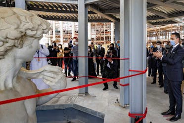 This handout picture obtained from Italy's Pavillion for EXPO 2020 in Dubai shows Italian Foreign Minister Luigi Di Maio (R) during a ceremony held at the Italian pavillion in the Gulf emirate to unveil a 3D-printed copy statue of Michelangelo's David (L) in the United Arab Emirates on April 27, 2021. (AFP)