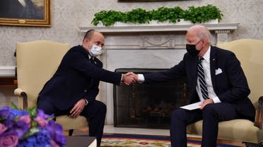 US President Joe Biden shakes hands with Israeli Prime Minister Naftali Bennett in the Oval Office of the White House in Washington, DC, on August 27, 2021. (AFP)