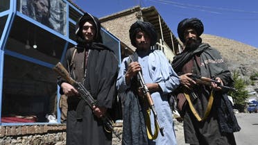 Taliban fighters pose for a picture in front of a bakery at a market area in Khenj district, Panjshir Province on September 15, 2021. (AFP)