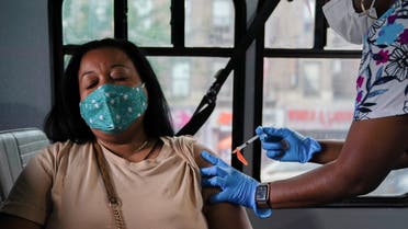 A person receives a dose of the Pfizer-BioNTech vaccine for the coronavirus disease (COVID-19), at a mobile inoculation site in the Bronx borough of New York City, New York, US, August 18, 2021. (Reuters)
