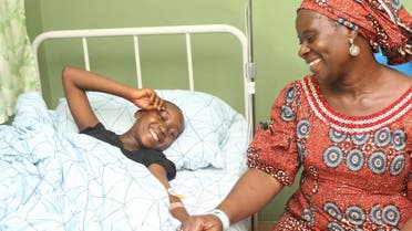 Bennice John Bivan (11), one of the 28 students of Bethel Baptist High School who have been released by their kidnappers is seen with her mother Rahila John Bivan at Wilbasun Hospital and Maternity in Kaduna on July 26, 2021. (AFP)