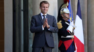 French President Emmanuel Macron gestures after a working lunch with Lebanese Prime Minister at the Elysee Palace, in Paris, on September 24, 2021. (AFP)