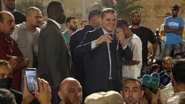 Libya's interim Prime Minister Abdulhamid Dbeibah greets a crowd in Tripoli's Martyrs' Square on September 21, 2021. (AFP)