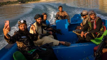 Taliban fighters enjoy a boat ride in the Qargha dam, outskirt of Kabul, Afghanistan, Friday, Sept. 24, 2021. (AP)(1)