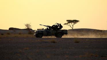 The Polisario Front soldiers drive a pick-up truck mounted with an anti-aircraft weapon during sunset in Bir Lahlou, Western Sahara, September 9, 2016. (Reuters/Zohra Bensemra)