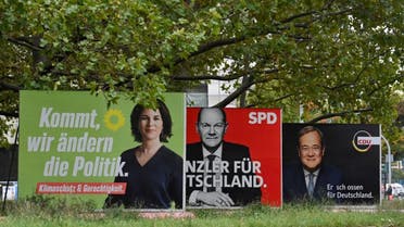 Billboards with election campaign posters showing the three chancellor candidates in the the September 26 federal election, (LtoR) co-leader of Germany's Greens (Die Gruenen) Annalena Baerbock, German Finance Minister and Vice-Chancellor of the Social Democratic SPD Party Olaf Scholz and Christian Democratic Union CDU leader Armin Laschet are seen in Berlin on September 25, 2021. (AFP)