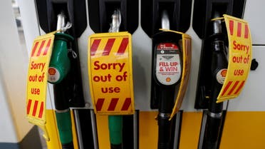 'Out of use' signs are seen on fuel pumps at a filling station that has run out of fuel, in London, Britain, September 25, 2021. REUTERS/Peter Nicholls