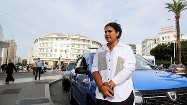 Female taxi driver Souad Hdidou, 33, stands near her taxi as she waits for passengers in Rabat, Morocco September 23, 2021. (Reuters)