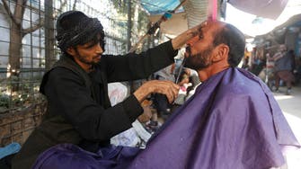 Forbidden business: Taliban prohibit barbers from shaving, trimming beards