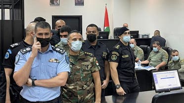 Palestinian security officers stand guard during a trial of security officers (not seen) over the death of Nizar Banat, a critic of President Mahmoud Abbas, in Ramallah in the Israeli-occupied West Bank September 14, 2021. (Reuters)