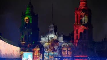Portraits of Mexican heroes of the Independence are projected onto the Metropolitan Cathedral during the 200th Anniversary of the Consummation of Mexican Independence at the Zocalo square in Mexico City on September 27, 2021. (AFP)