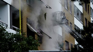 Smoke comes out of windows after an explosion hit an apartment building in Annedal, central Gothenburg, Sweden September 28, 2021. (Reuters)