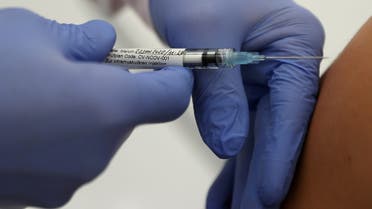 Professor Gottfried Kremsner injects a vaccination against the coronavirus disease (COVID-19) from German biotechnology company CureVac to a volunteer at the start of a clinical test series at his tropical institute of the university clinic in Tuebingen, Germany, June 22, 2020. (File Photo: Reuters)