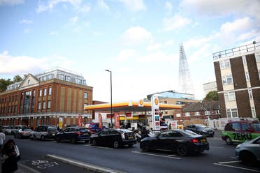 Vehicles queue to refill at a Shell fuel station in central London, Sept. 27, 2021. (Reuters)