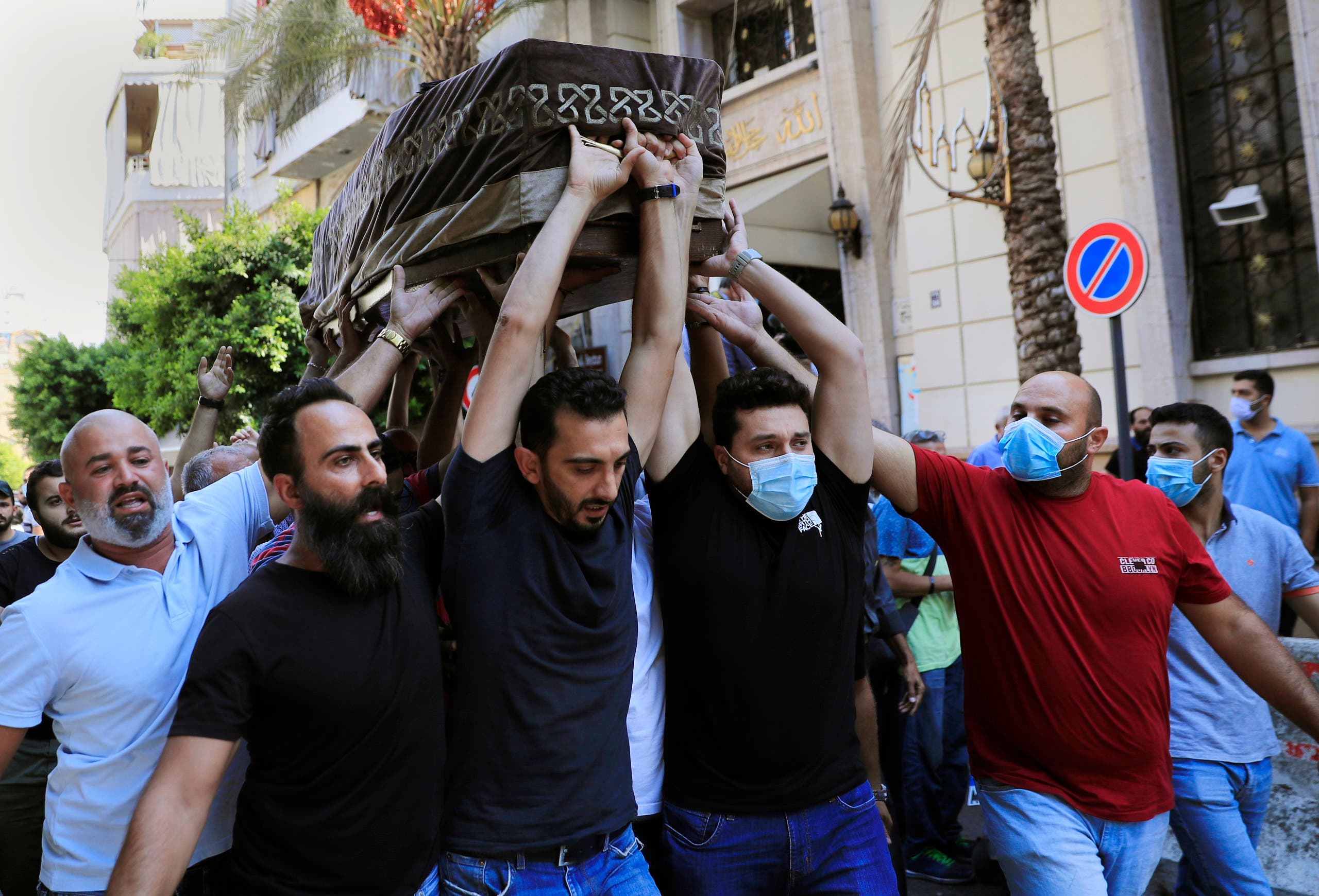 Mourners carry the coffin of Ibrahim Harb, 35, who was critically injured in the massive explosion at Beirut's port last year and who died ></p><br />
<p class=