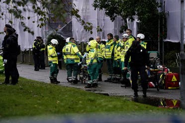 An emergency services crew works to evacuate people and put out fire after an explosion hit an apartment building in Annedal, central Gothenburg, Sweden September 28, 2021. (Reuters)