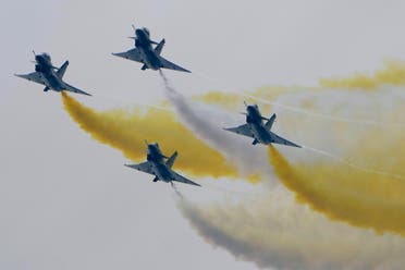 Members of the “August 1st” Aerobatic Team of the Chinese People’s Liberation Army (PLA) Air Force perform during the 13th China International Aviation and Aerospace Exhibition, on Sept. 28, 2021, in Zhuhai in southern China's Guangdong province. (AP)