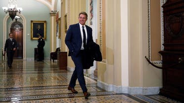 Former Senator Jeff Flake walks through the Ohio Clock Corridor off the Senate floor, Jan. 21, 2020. (Reuters)