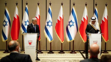 Israeli Foreign Minister Yair Lapid and Bahrain's Foreign Minister Abdullatif al-Zayani take part in a news conference, Manama, Bahrain, on September 30, 2021. (Reuters)