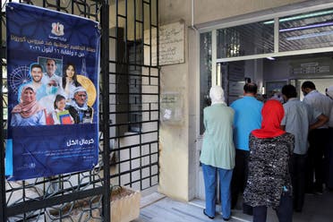 People wait to get the coronavirus disease (COVID-19) vaccine at a vaccination center in Damascus, Syria September 29, 2021. Picture taken September 29, 2021. (Reuters/Firas Makdesi)
