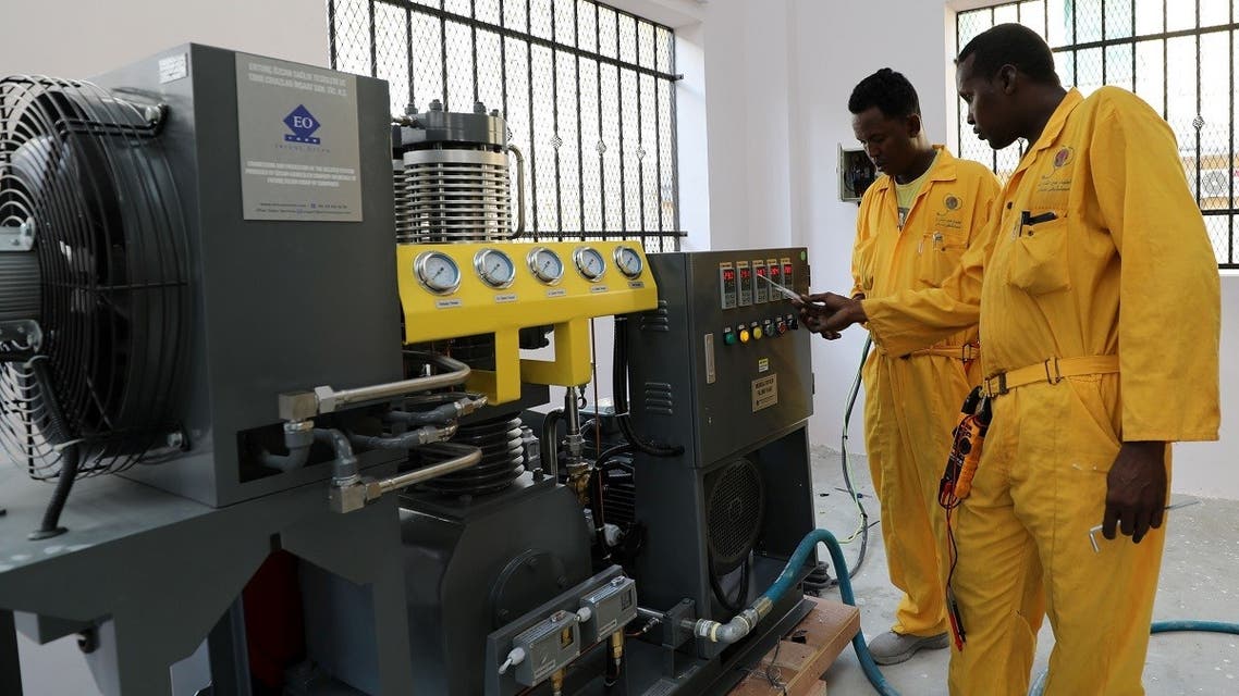 Workers install the public oxygen plant amid the coronavirus disease (COVID-19) pandemic at the Banadir Hospital in Mogadishu, Somalia September 28, 2021. (Reuters/Feisal Omar)