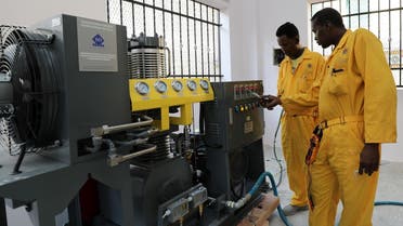 Workers install the public oxygen plant amid the coronavirus disease (COVID-19) pandemic at the Banadir Hospital in Mogadishu, Somalia September 28, 2021. (Reuters/Feisal Omar)
