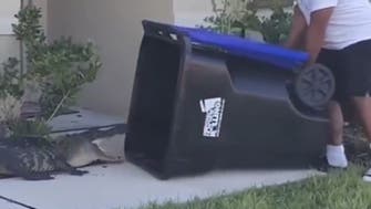 Florida man goes viral after trapping alligator in trash can