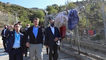 Greek Prime Minister Kyriakos Mitsotakis and Migration Minister Notis Mitarachi visit a disused migrant camp on the island of Samos, Greece, October 1, 2021. (Reuters/Costas Baltas)