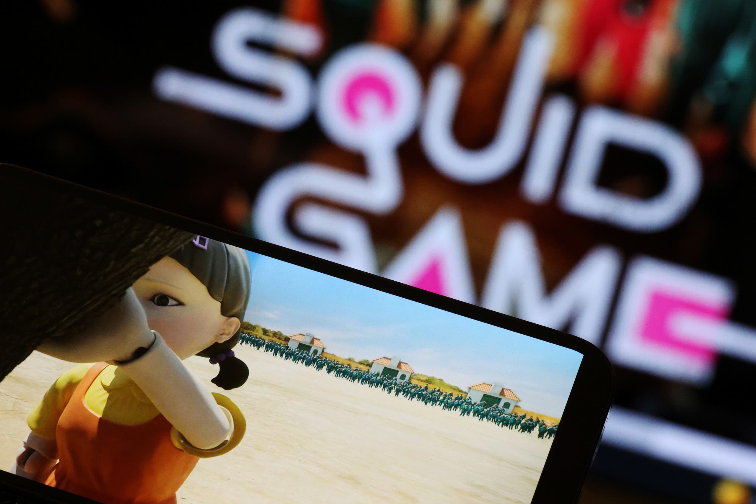 The Netflix series Squid Game is played on a mobile phone in this picture illustration taken September 30, 2021. (Reuters)