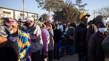 People queue outside a polling station in Lusaka on August 12, 2021. (AFP)