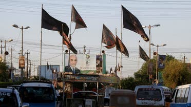 لافتات انتخابية في العراق (أرشيفية- رويترز)