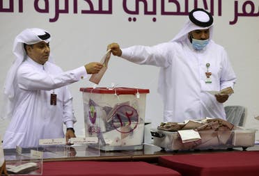 Qatari members of staff close the polling station and start counting votes during the Gulf Arab state's first legislative elections for two-thirds of the advisory Shura Council, in Doha, Qatar, October 2, 2021. (Reuters)